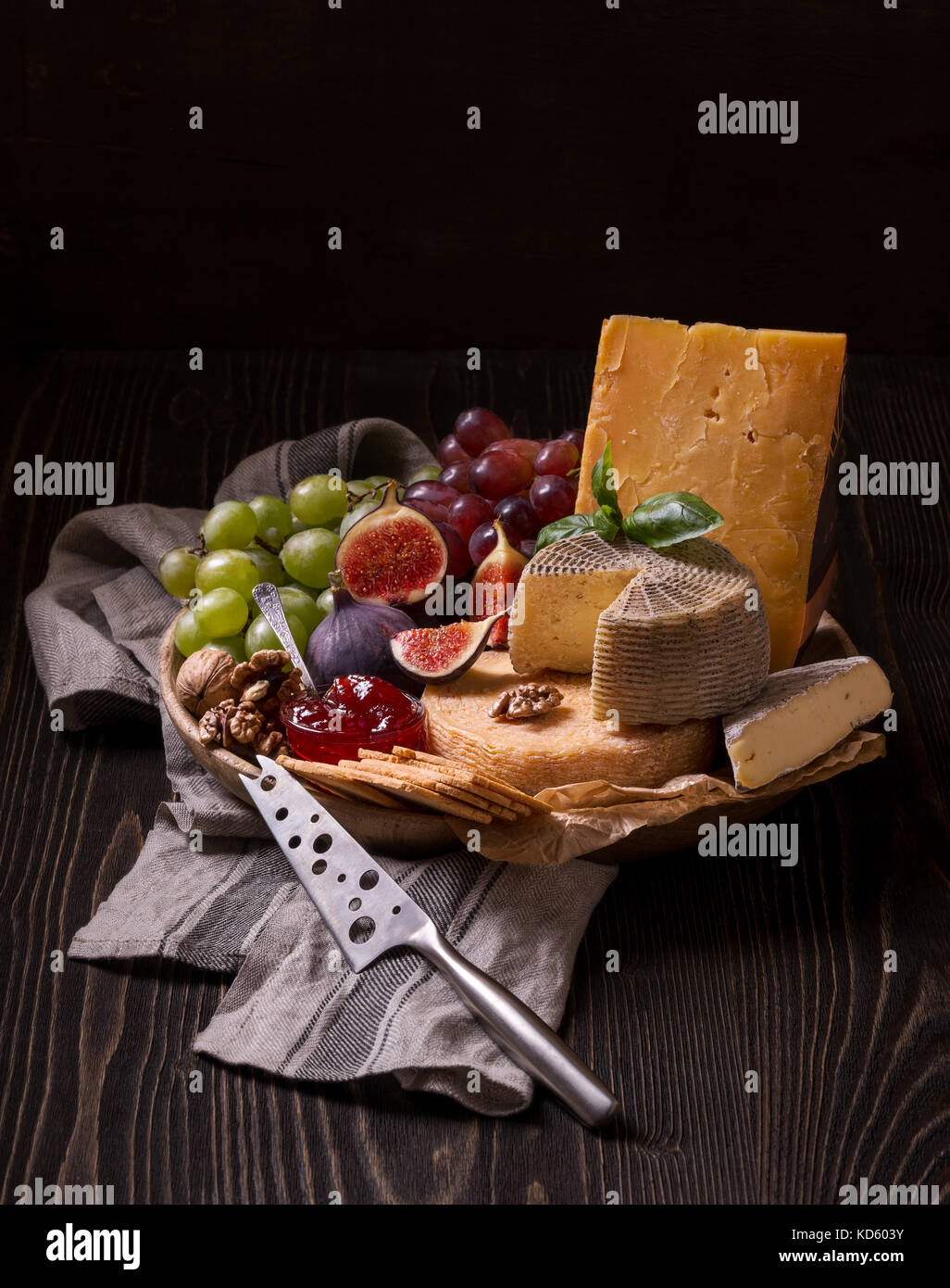 Cheese platter on the rough wood Stock Photo
