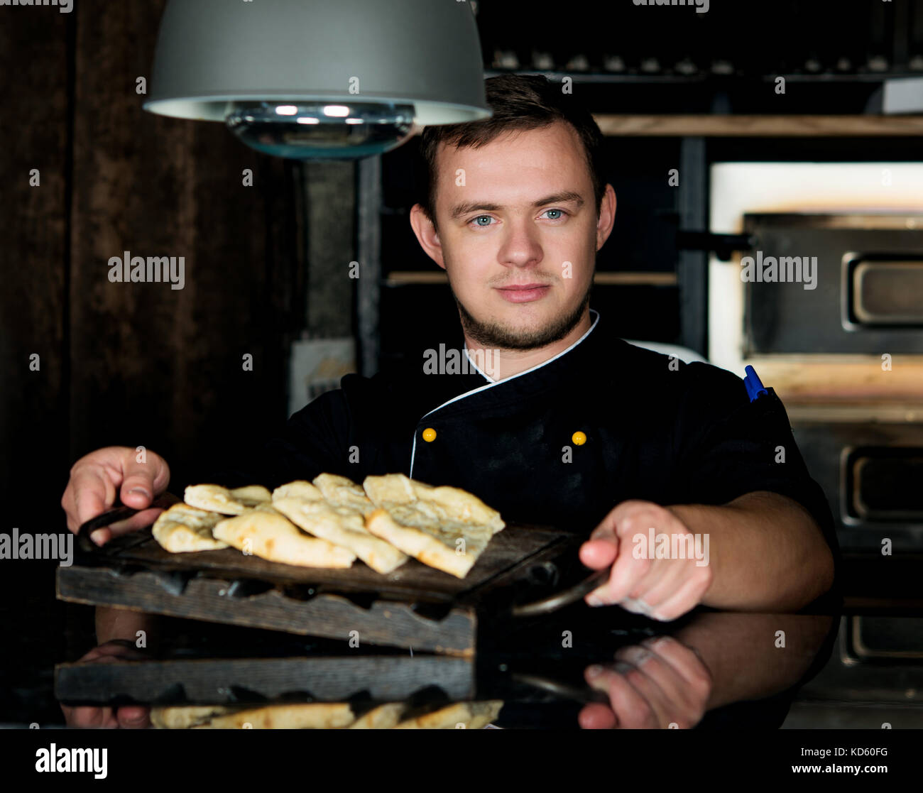 Man cooking wood fire pizza hires stock photography and images Alamy