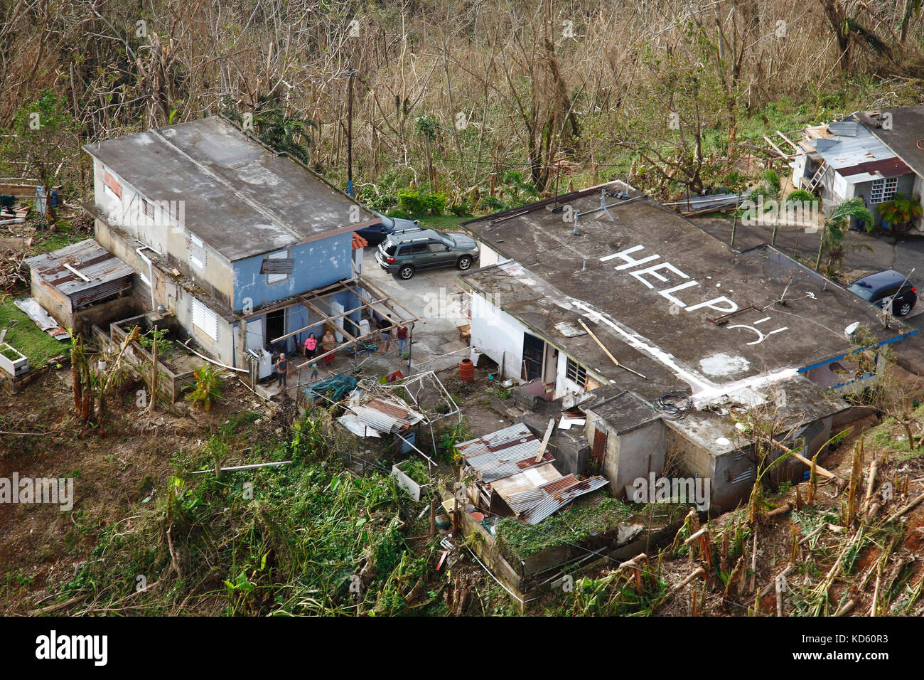 A home in Puerto Rico is spotted with the word 'HELP' painted on its roof. Stock Photo