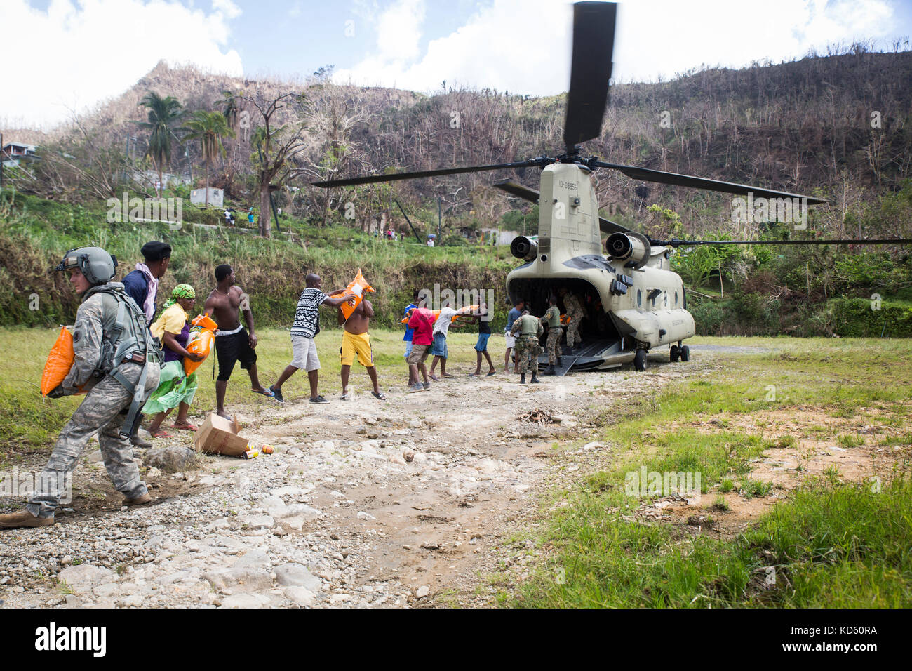 Aid being offloaded from a helicopter to people after Hurricane Maria tore through the caribbean and Puerto Rico. Stock Photo
