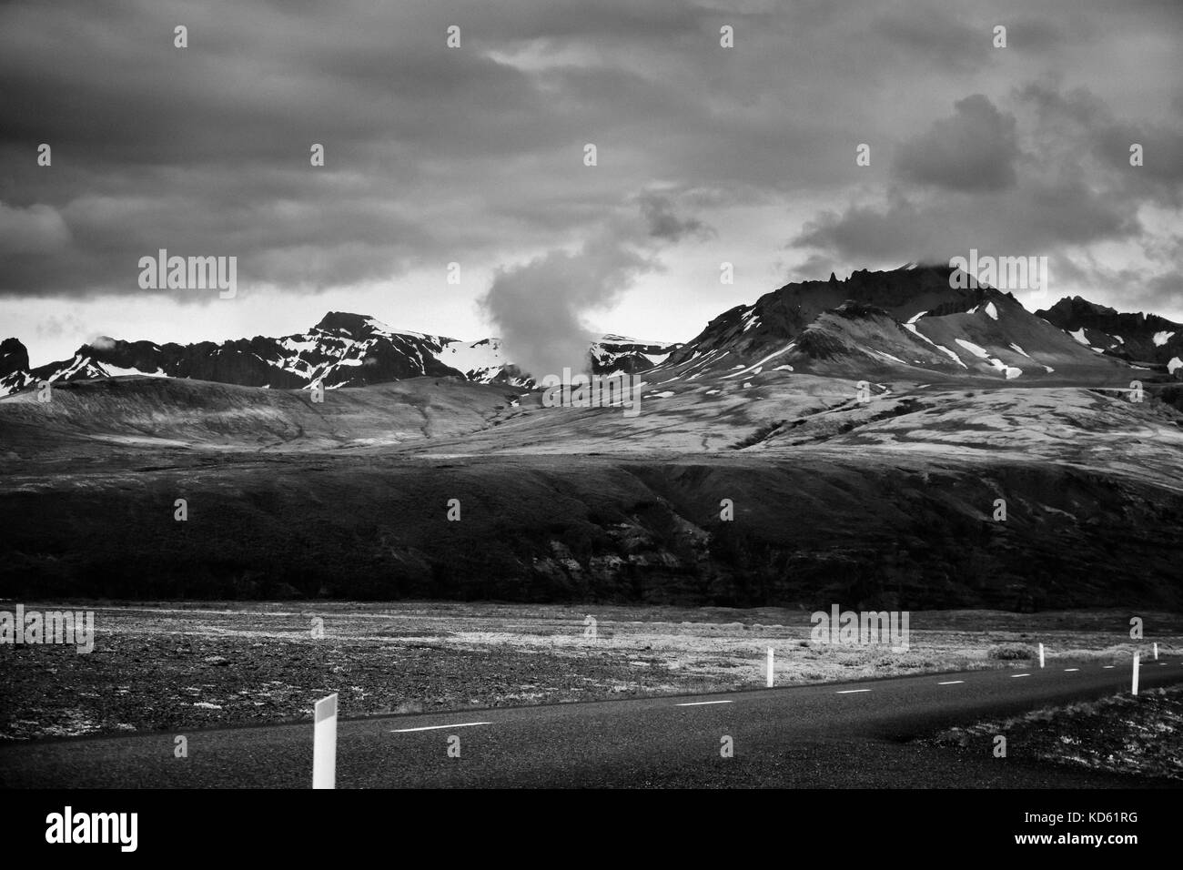 View to mountains and Vatnajokull glacier, in Skeidararsandur, Iceland in summer, rich black and white with grain Stock Photo