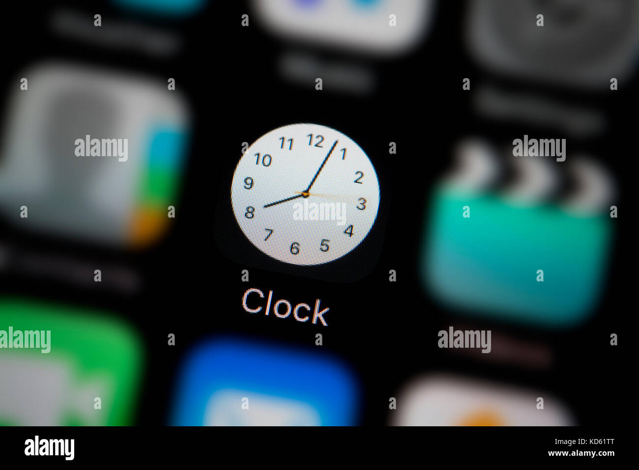 A close-up shot of the Clock app, as seen on the screen of an Apple iPhone (Editorial use only) Stock Photo
