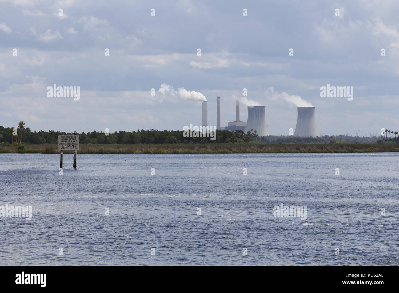 Power plant cooling towers viewed over Florida wetlands Stock Photo