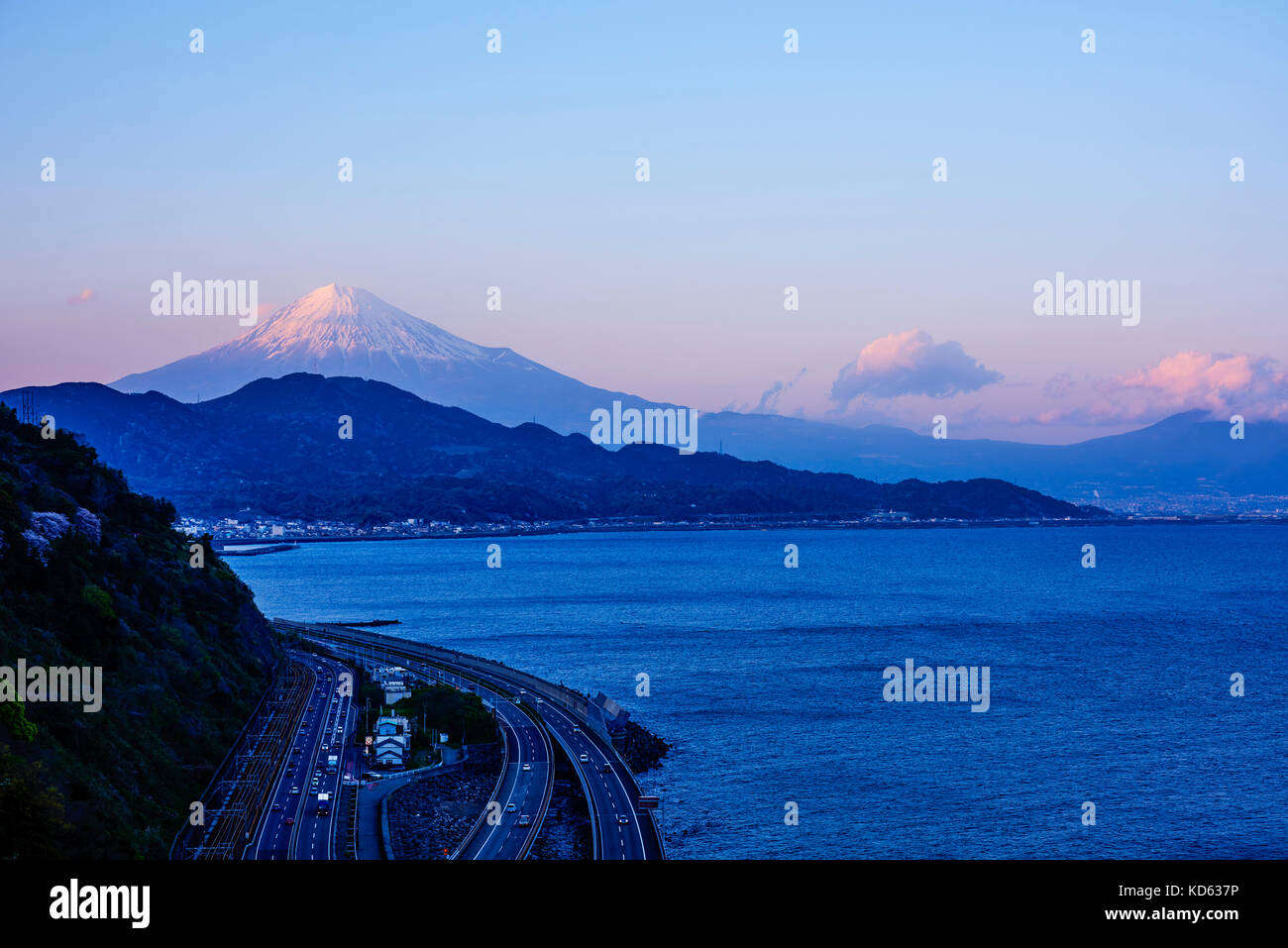 Night view of Mount Fuji and highway from Satta ridge at sunset, Shizuoka Prefecture, Japan Stock Photo