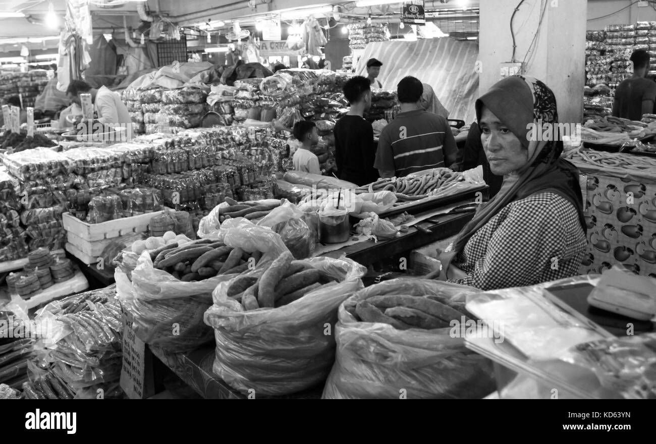 Woman selling foodstuff at Pasar Payang (Payang Market) in Kuala Terengganu, Terengganu Stock Photo