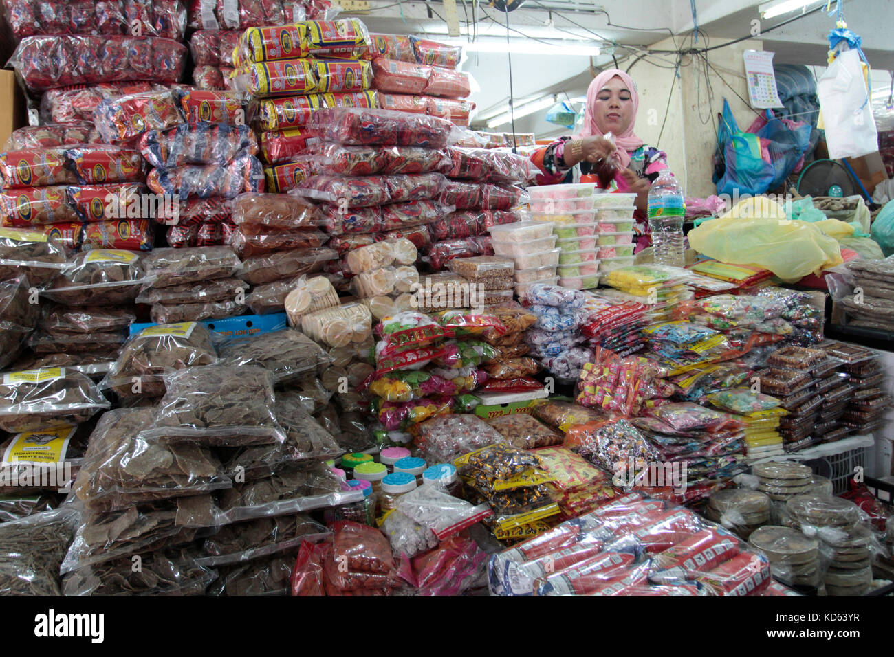 Woman selling foodstuff at Pasar Payang (Payang Market) in Kuala Terengganu, Terengganu Stock Photo