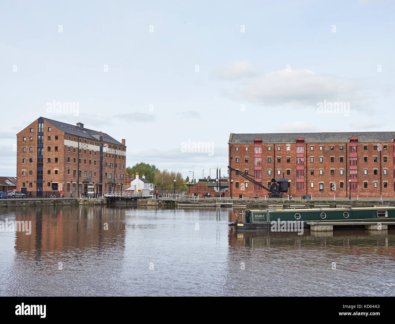 The City of Gloucester and Gloucester docks and warehouses and canal narrow boat Stock Photo