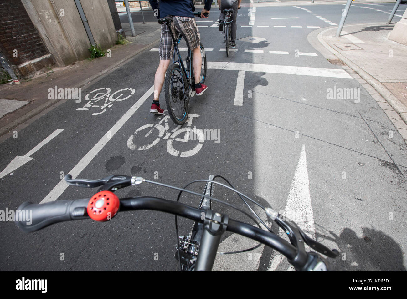 Cycling in a city, special road marks for bicycle lanes, Stock Photo
