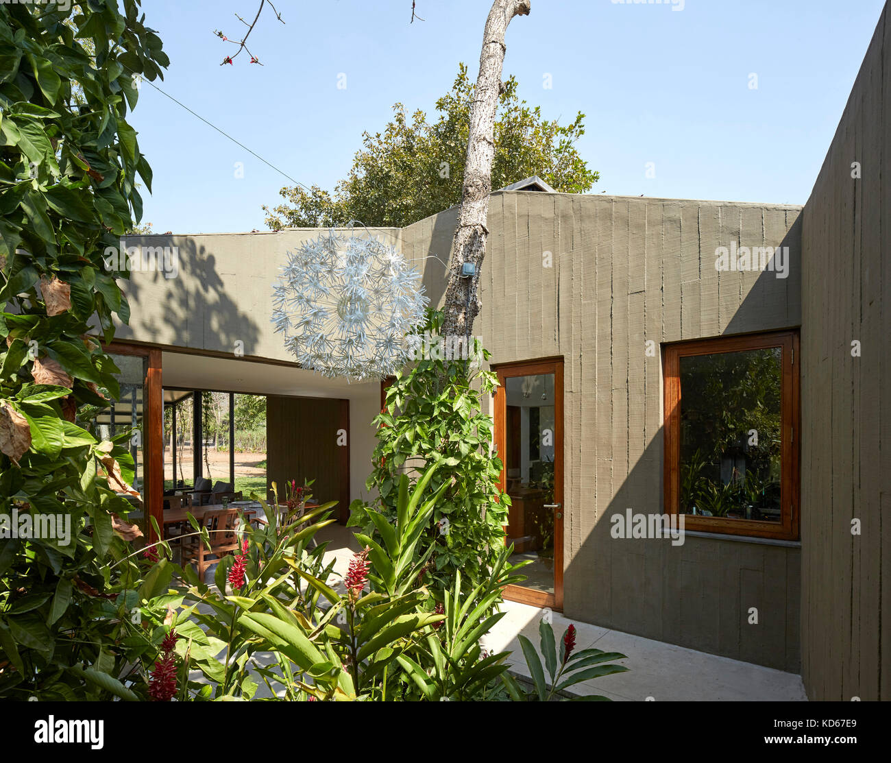 Side view. House on a stream, Alibaug, India. Architect Architecture