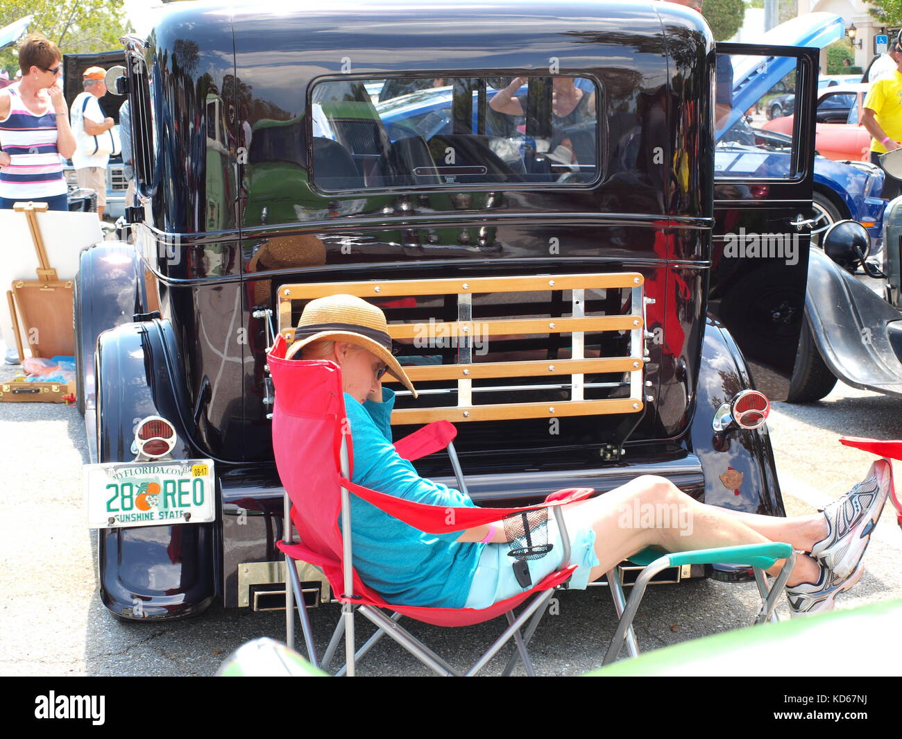 Snoozing in the sun at a east coast Florida car show. Stock Photo