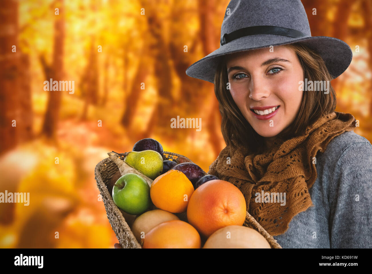 Portrait of woman carrying fruits and vegetables in basket against ...