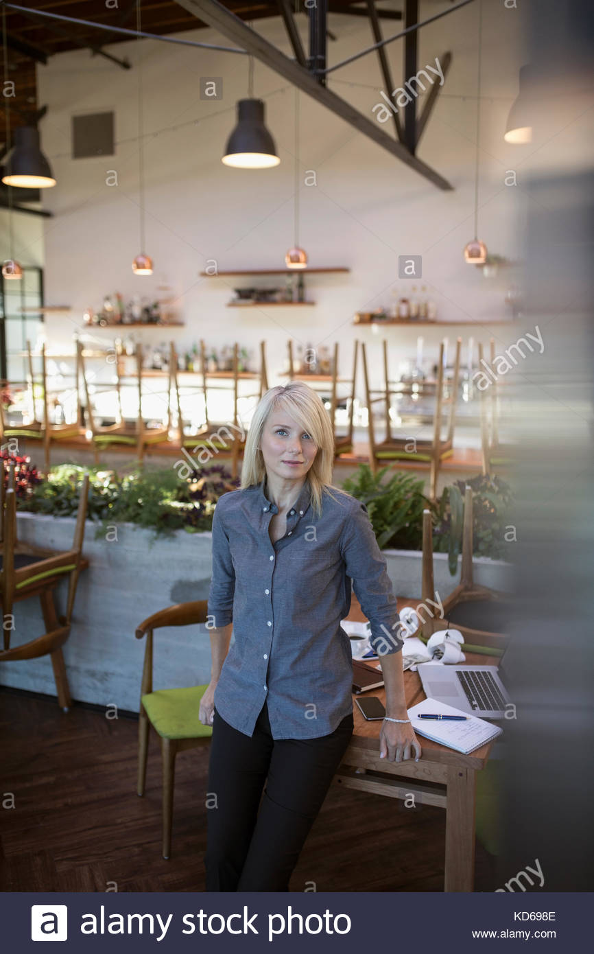 Portrait confident female cafe business owner Stock Photo
