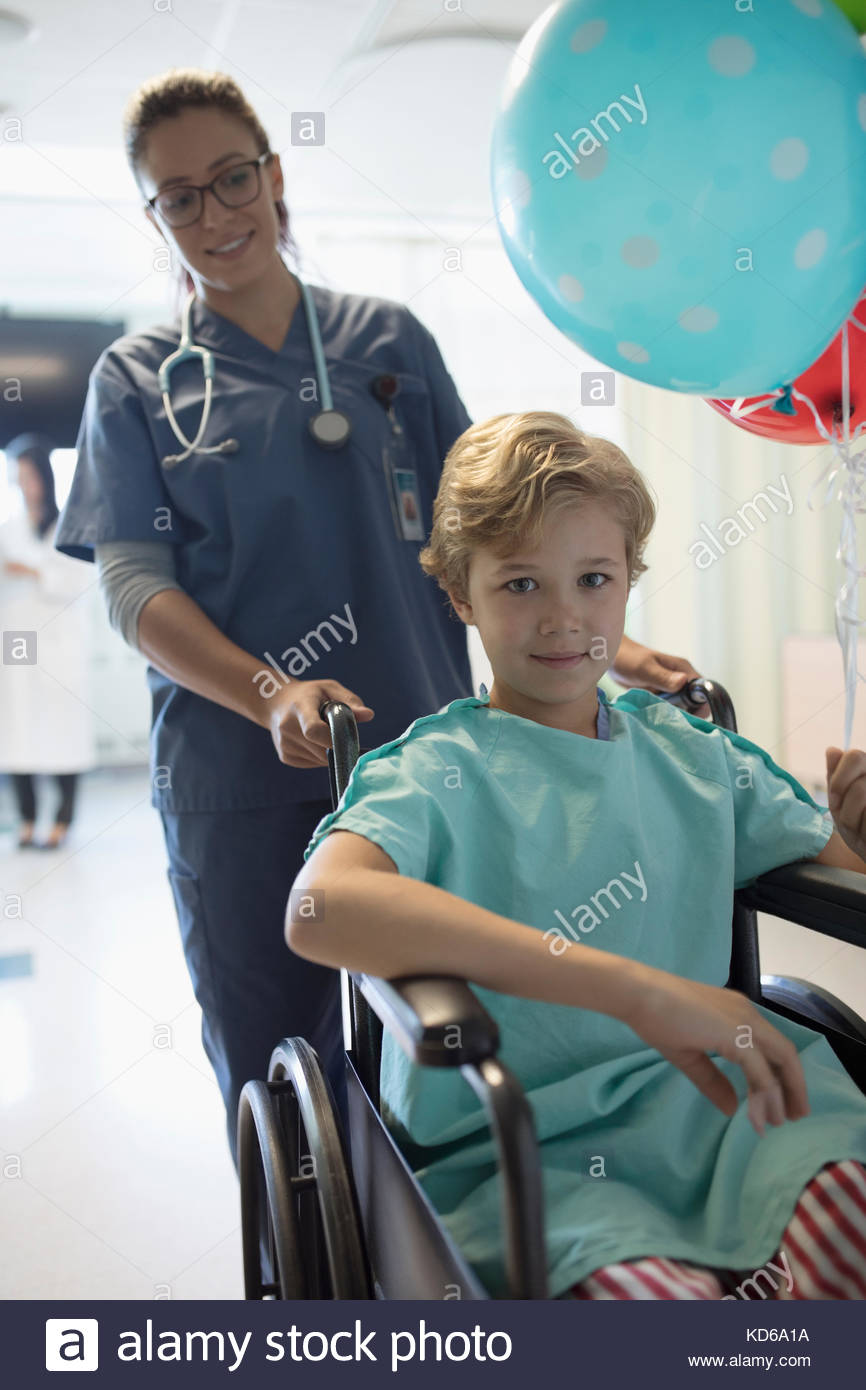 Boy pushing boy wheelchair hi-res stock photography and images - Alamy