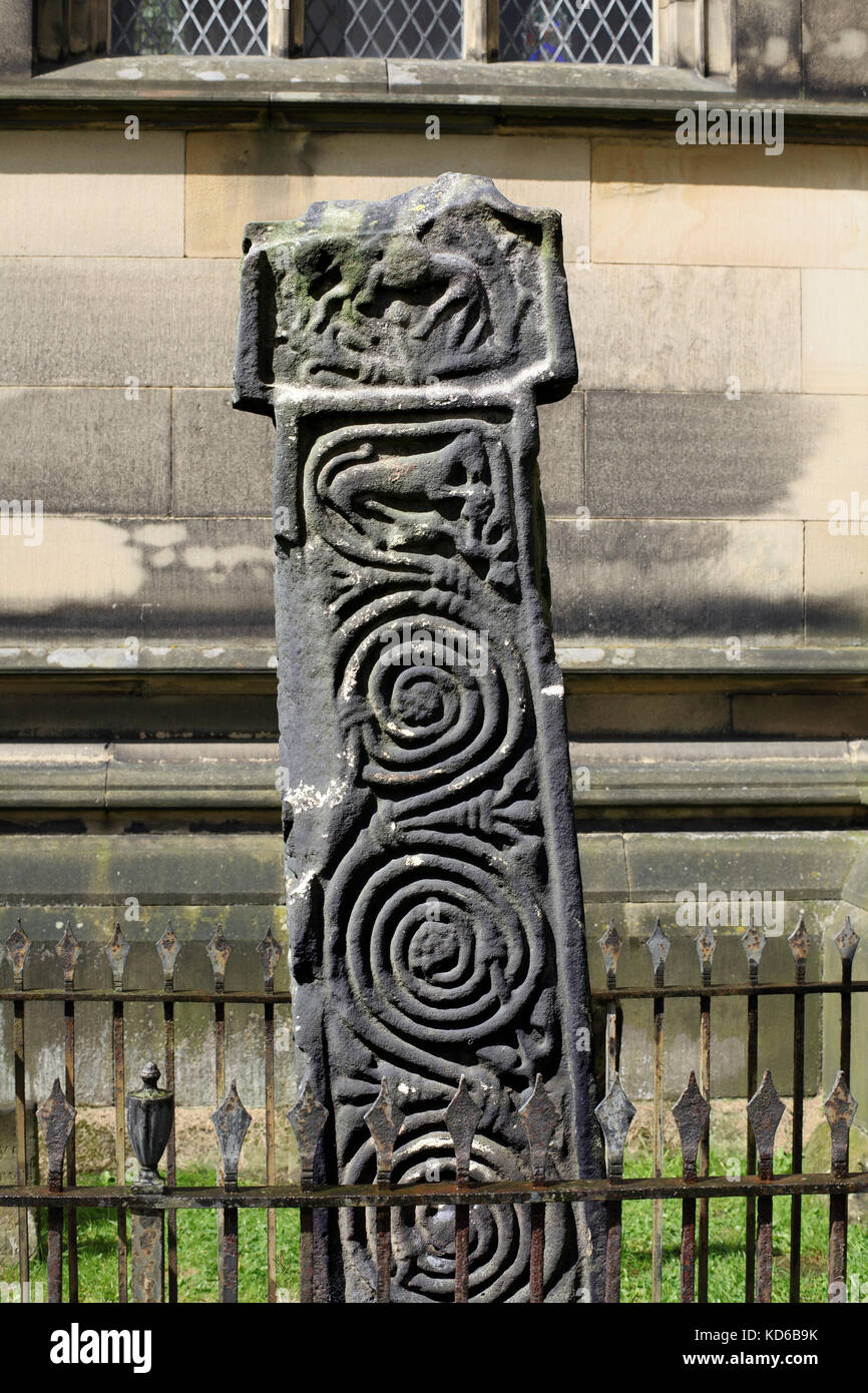 Carved spiral scrollwork on an Anglo-Saxon cross (dating from 7th to 9th century), All Saints churchyard, Bakewell, Derbyshire. Stock Photo