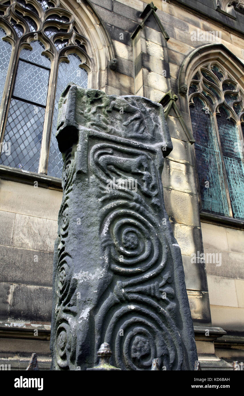 Carved spiral scrollwork on an Anglo-Saxon cross (dating from 7th to 9th century), All Saints churchyard, Bakewell, Derbyshire. Stock Photo