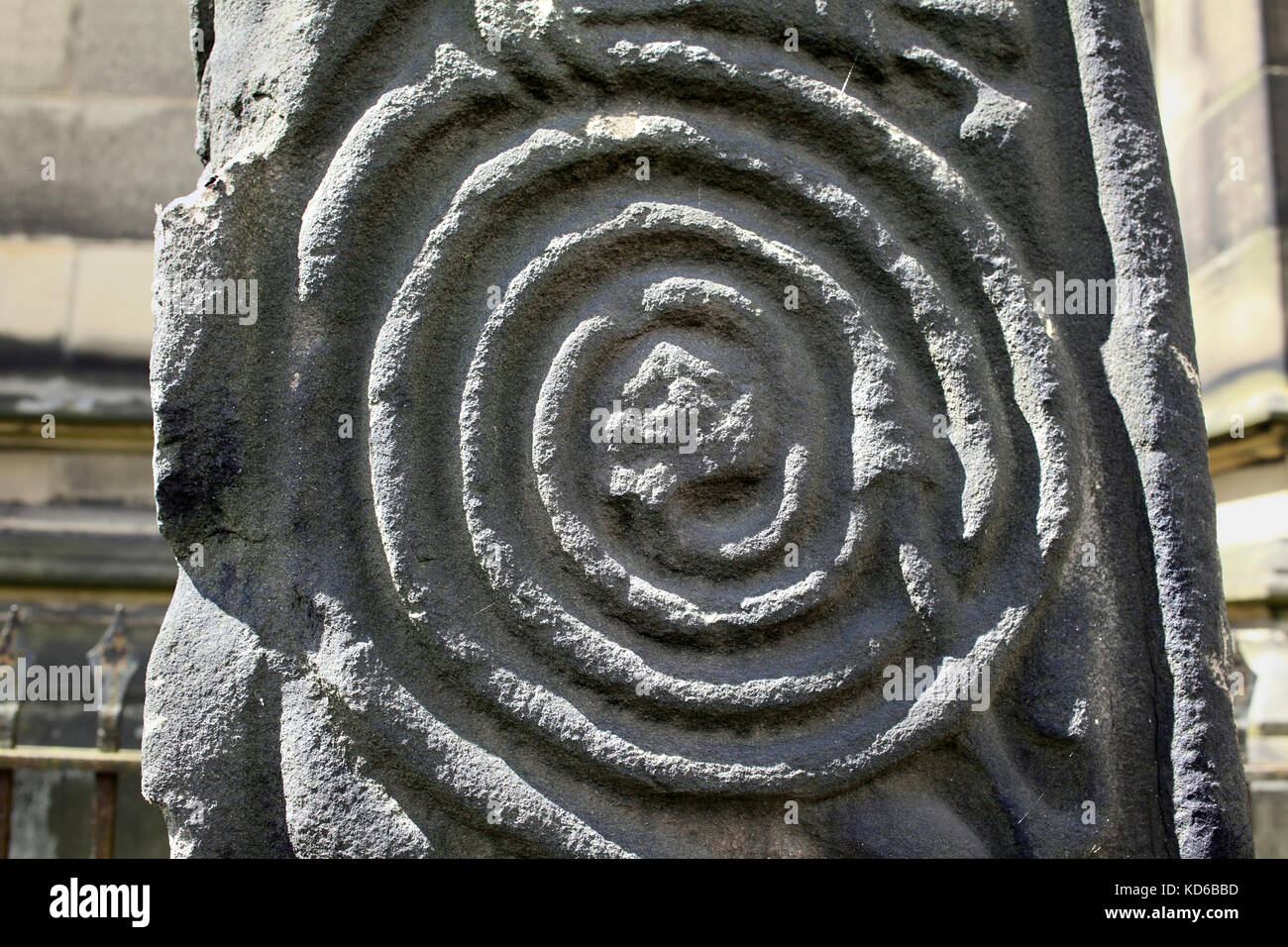 Close up of spiral scrollwork on a medieval cross, All Saints' churchyard, Bakewell, Derbyshire. Stock Photo