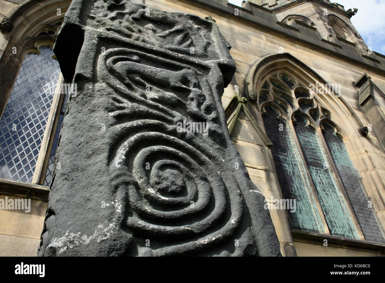 Carved spiral scrollwork on an Anglo-Saxon cross (dating from 7th to 9th century), All Saints churchyard, Bakewell, Derbyshire. Stock Photo