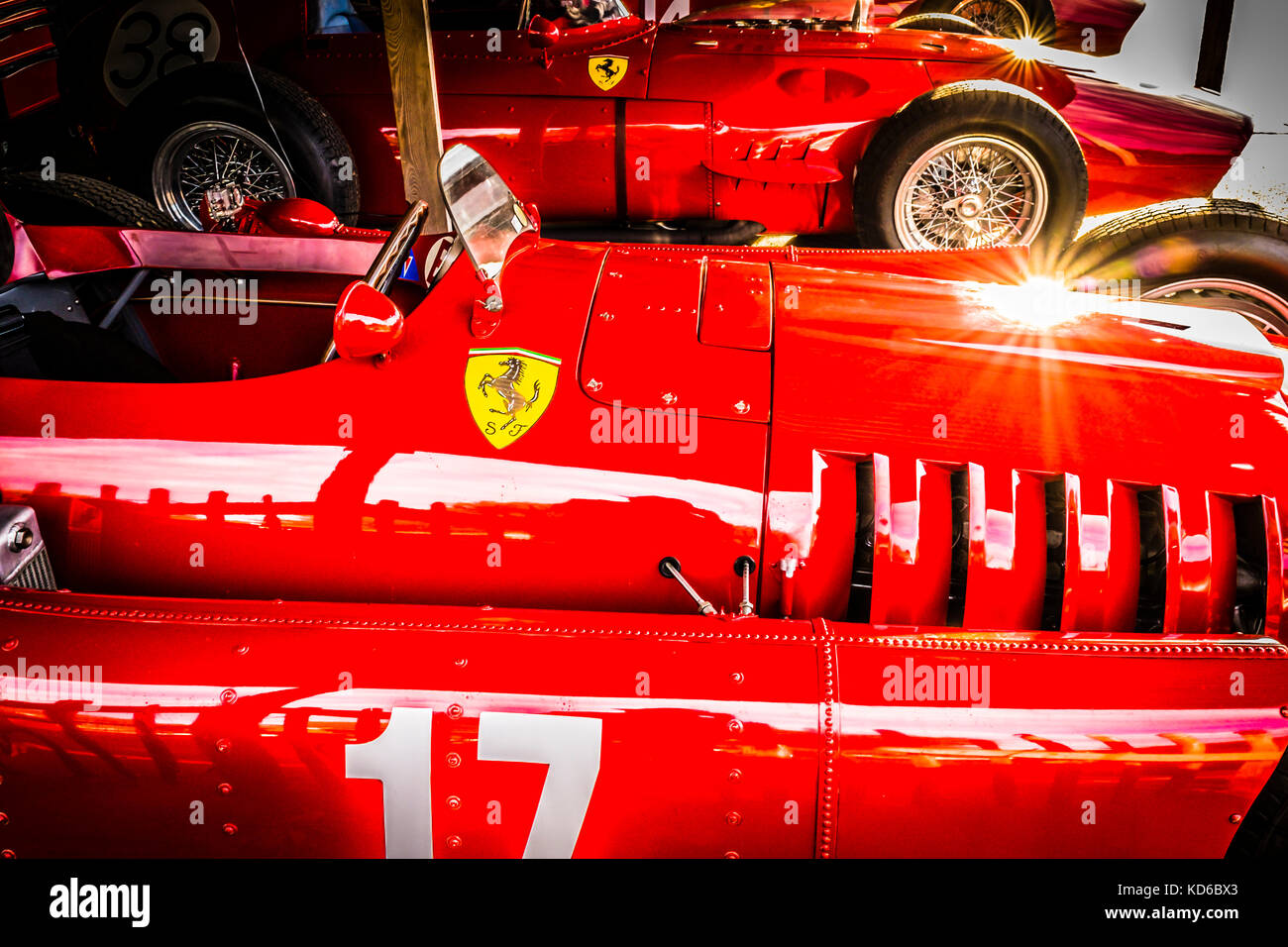 1954 Lancia D50 and 1960 Ferrari 246 Dino catch the early morning sun in the paddock garage at the 2017 Goodwood Revival, Sussex, UK. Stock Photo