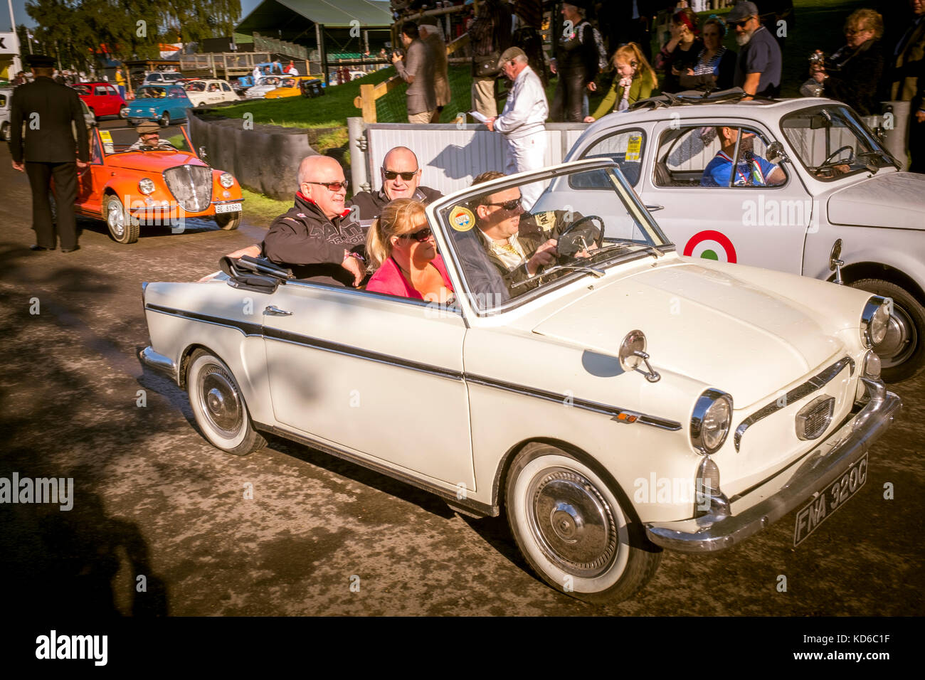 The classic Fiat 500 is celebrated in an Italian cavalcade at the 2017 Goodwood Revival, Sussex, UK. Stock Photo