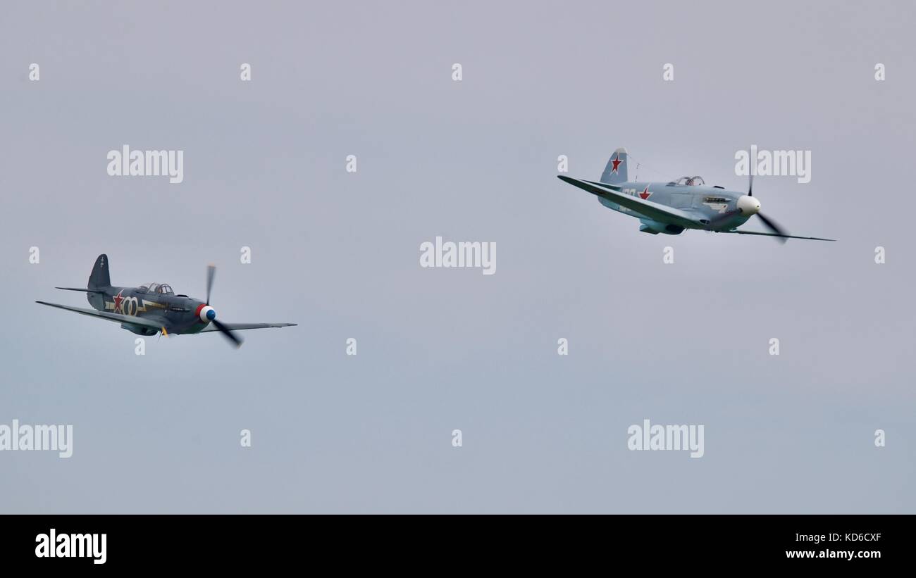 yakovlev Yak-3M & Yak-3UA flying in close formation at  the 2017 Battle of Britain Air Show at IMW Duxford Stock Photo