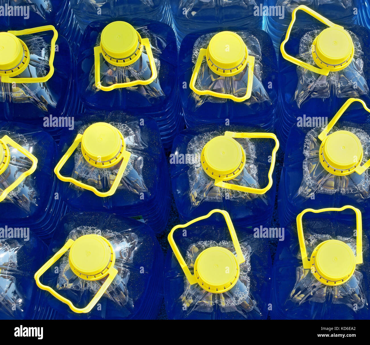 Download Closed Plastic Containers With Blue Liquid And Yellow Caps Stock Photo Alamy Yellowimages Mockups
