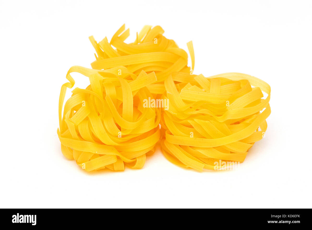 Fresh traditional dry italian pasta tagliatelle nests Stock Photo Alamy