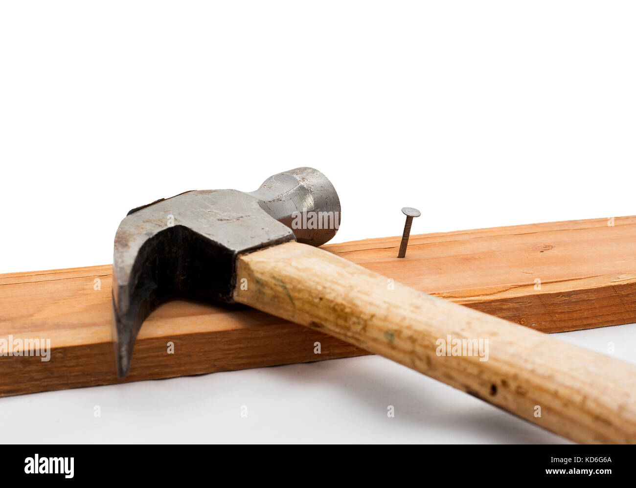Hammer and Rivet Hammered into a Wooden Piece, Isolated on White Background Stock Photo Alamy
