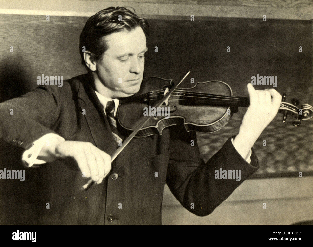 Adolf Busch playing the violin. German violinist and composer (1891-1952).  Photo by Fox. Stock Photo