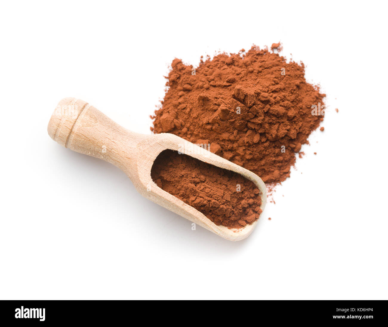 Dark cocoa powder in wooden scoop isolated on white background. Stock Photo
