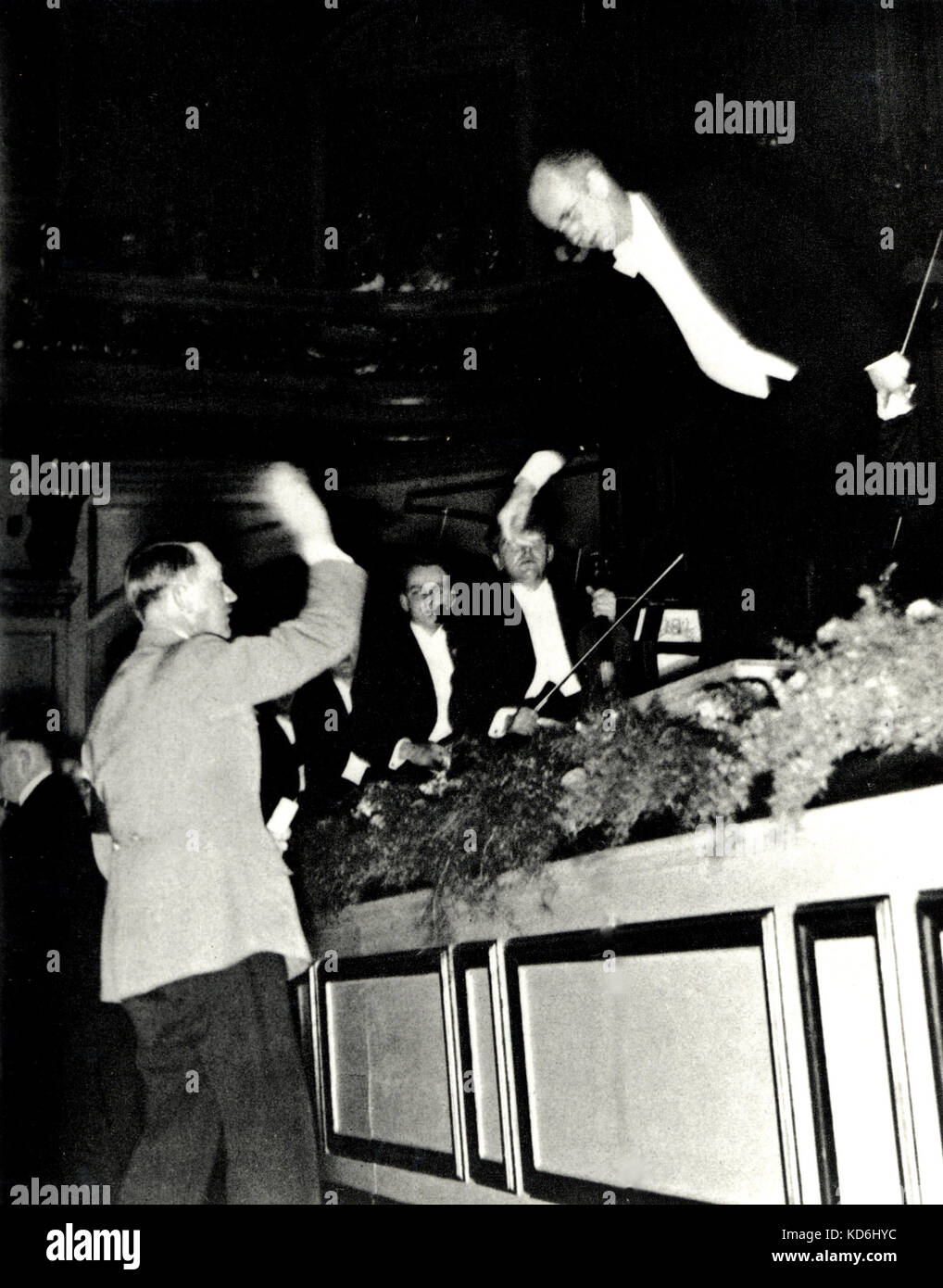 Wilhelm Furtwangler reaching out to shake hands with Hitler, instead of responding with the Heil Hitler gesture, at the end of a concert, 1939. Stock Photo