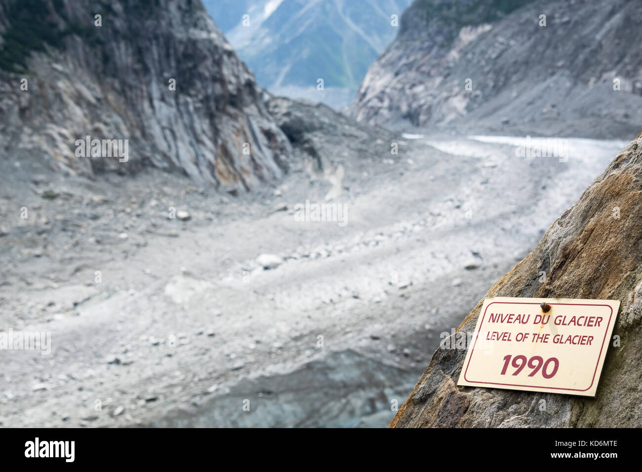 Sign indicating the level of the Glacier Mer de Glace in 1990, glacier melting illustration, in Chamonix Mont Blanc Massif, The Alps, France Stock Photo