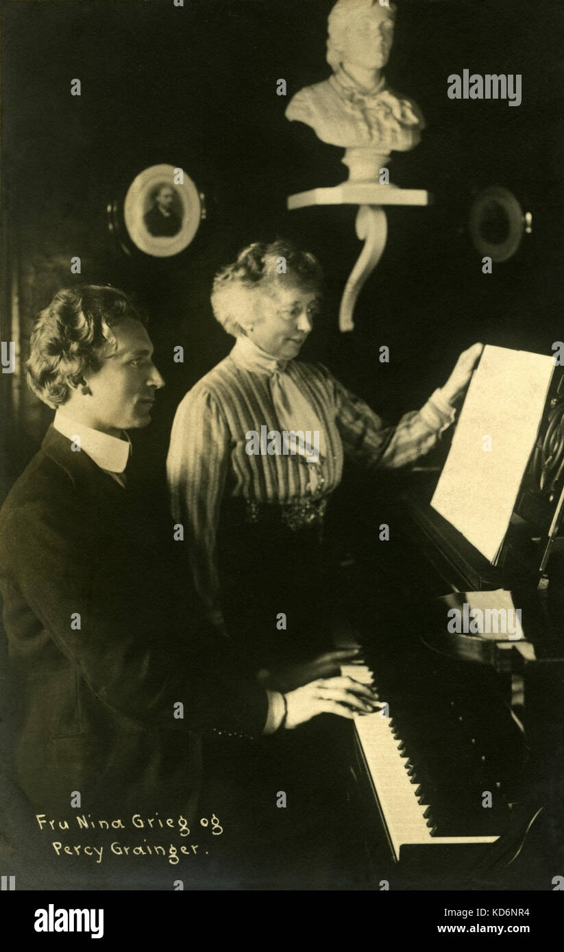 Percy Grainger playing the piano with Nina Grieg looking at the score. Australian-American pianist 8 July 1882- 20 February 1961.  Grainger was a close friend and admirer of Edward Grieg and his wife. Stock Photo