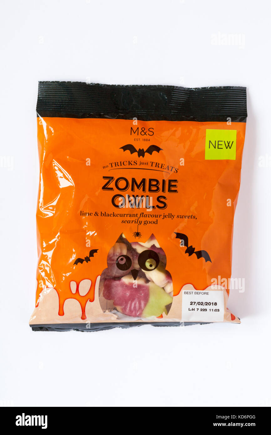 Packet of M&S Zombie Owls lime & blackcurrant flavour jelly sweets scarily good - no tricks just treats for Halloween isolated on white background Stock Photo