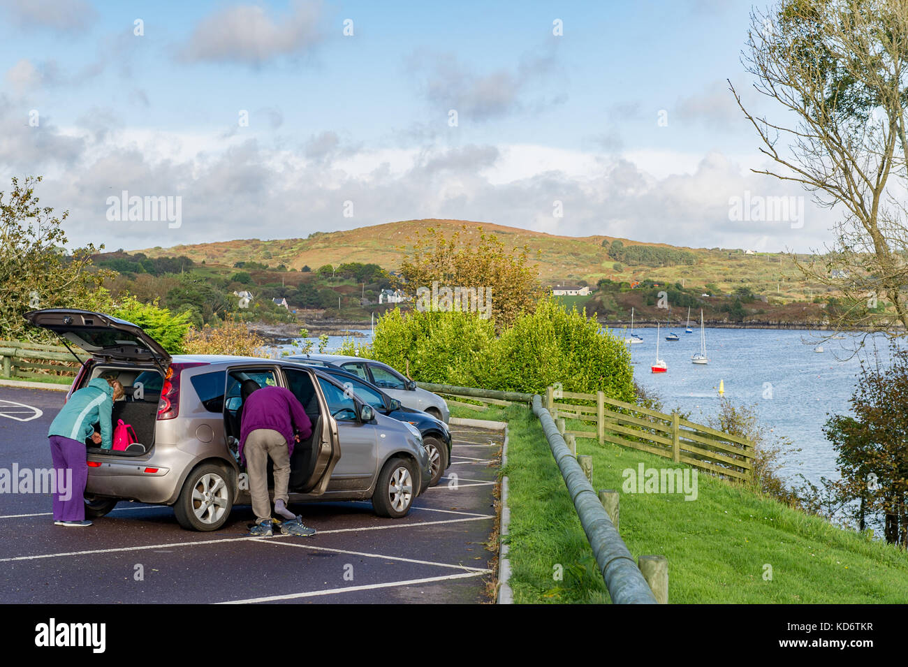 Walkers in Schull, Ireland preparing to leave their car for a walk or ramble with copy space. Stock Photo