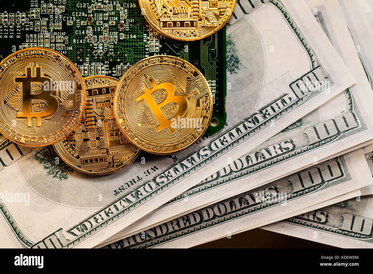 Bitcoin coins on a bundle with dollars. The concept of investing money in  cryptocurrency and making a profit due to the fall in the dollar exchange  ra Stock Photo - Alamy