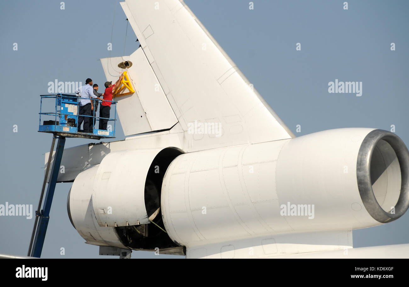 Miami, Florida - February 14, 2009: Crews remove rudder from big DC-10 jet airplane. The airplane is being dismantled and sold for parts at the Opa Lo Stock Photo