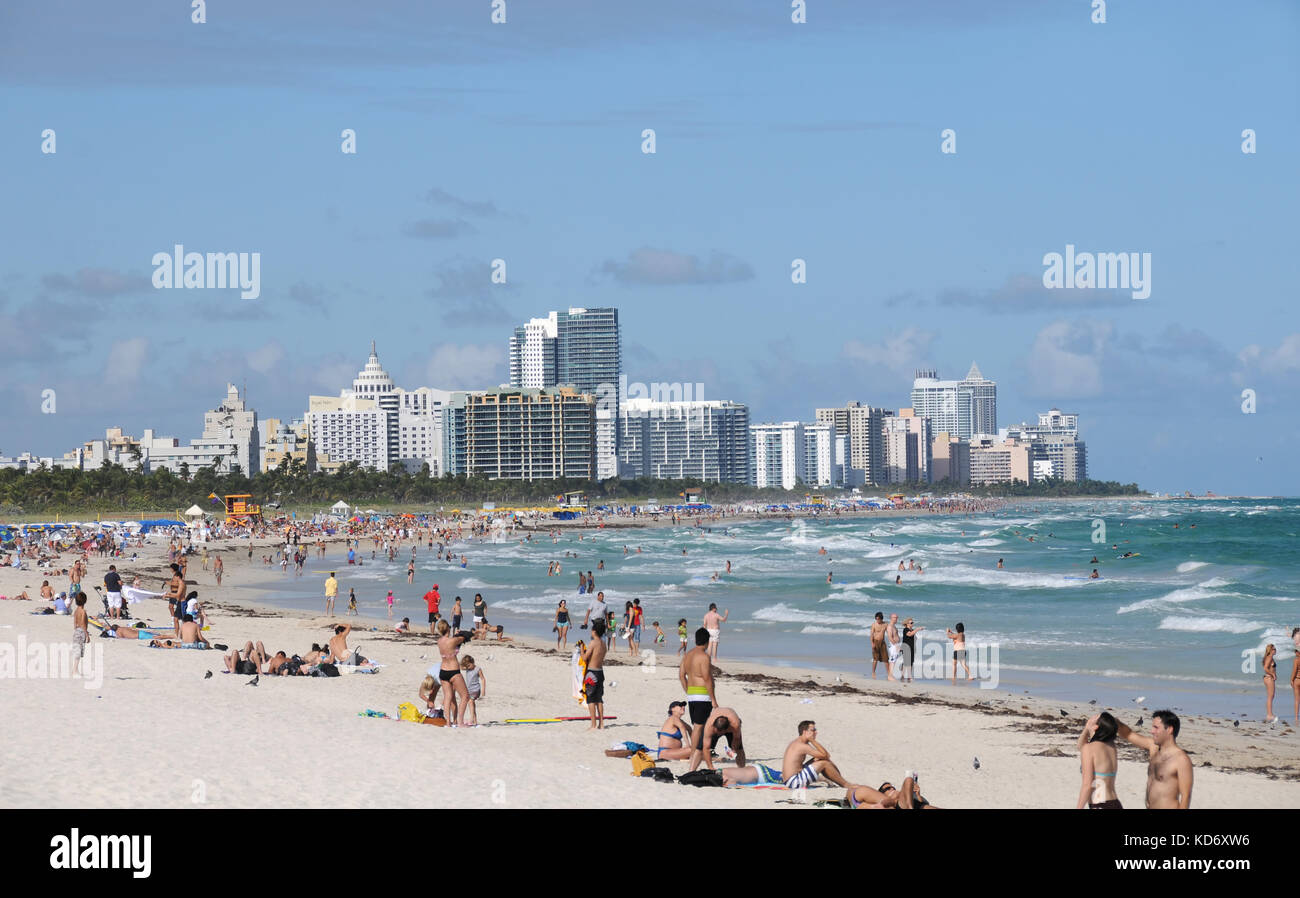 Miami, USA - November 25, 2010: Tourists enjoy a sunny day in Miami Beach, Florida. Winter months a popular time of the year to visit Florida Stock Photo