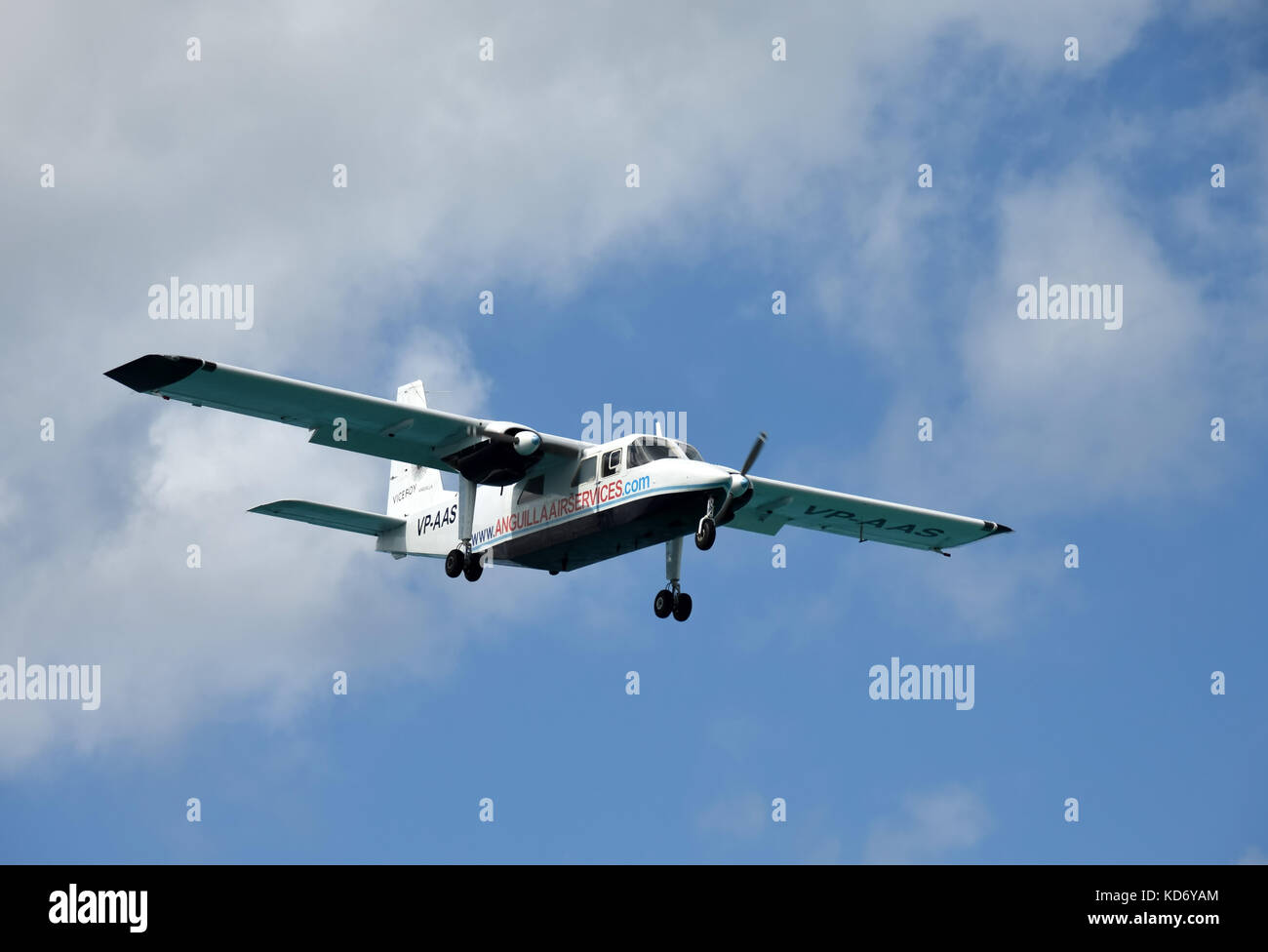 PHILIPSBURG - DECEMBER 24: Anguilla Air Services turboprop airplane arrives in Philipsburg, Saint Maarten in the Caribbean. The airline connects the s Stock Photo