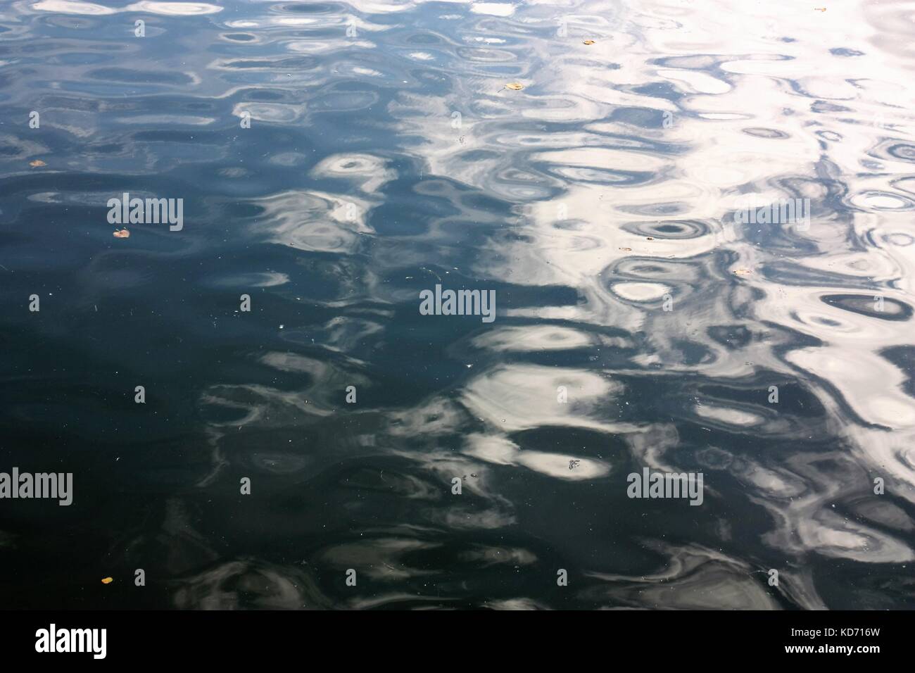 Water surface blue light waves with reflections Stock Photo - Alamy