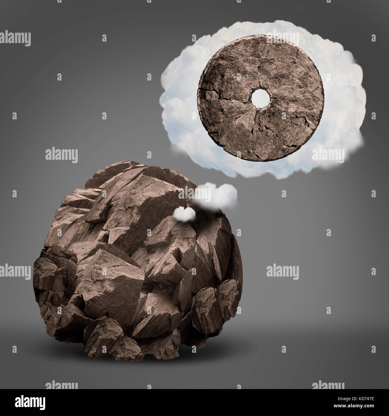 Dreaming of success and aspiration for ambition imagination as a rough rock imagining  becoming a wheel in a dream cloud bubble. Stock Photo