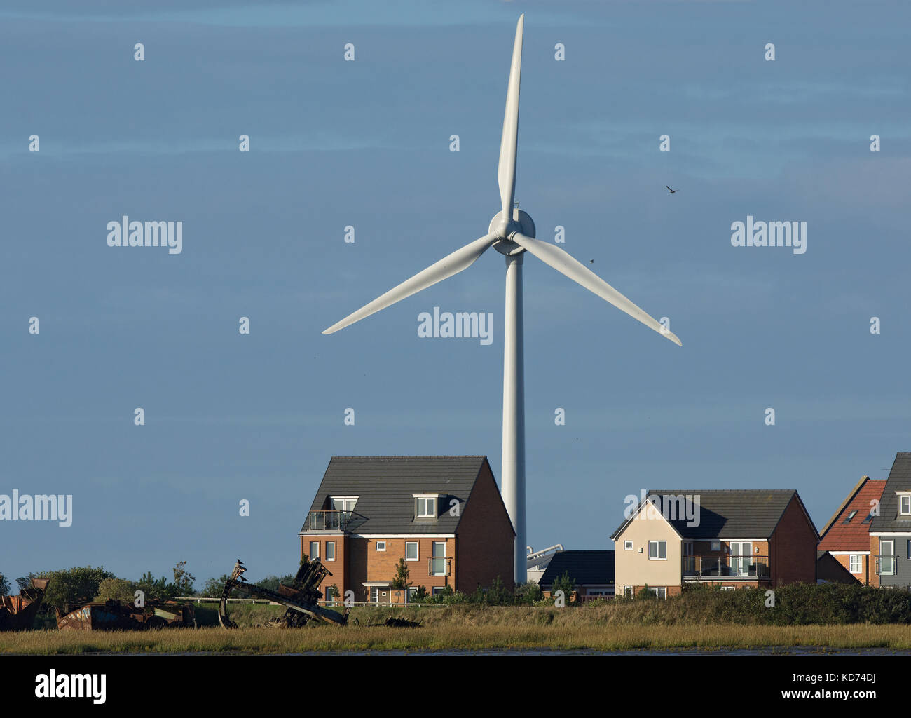 Newly built house with large wind turbine behind, Lancashire, UK Stock Photo