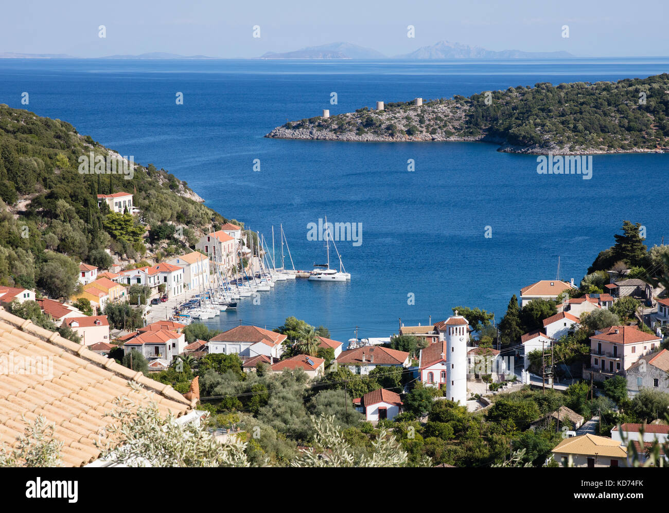 View over the the little harbour of Kioni and its three windmills on the coast of Ithaka in the Ionian Islands of Greece Stock Photo