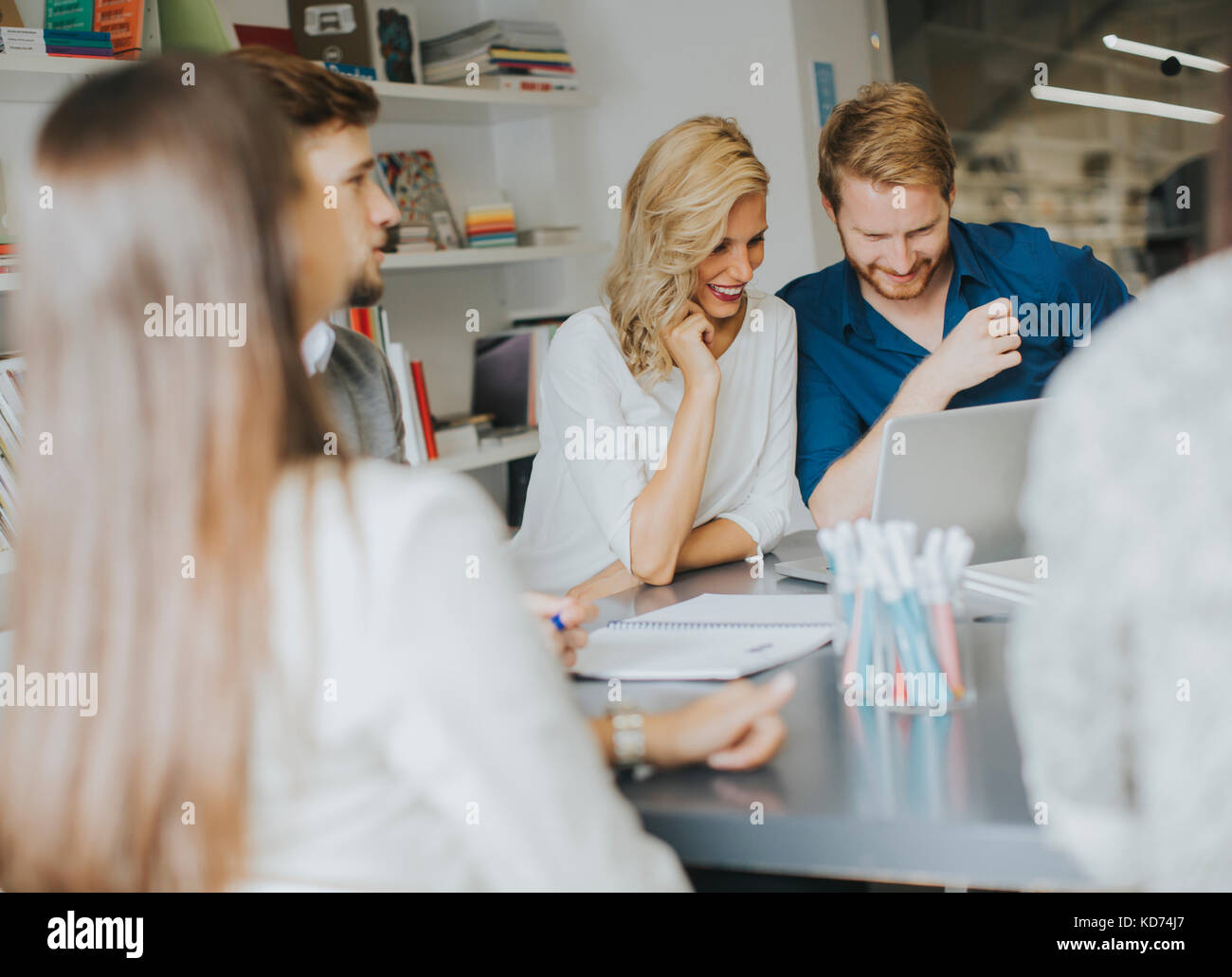 Group of businesspeople working at open space office Stock Photo - Alamy