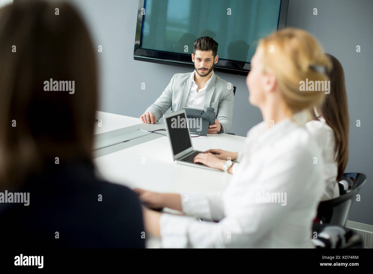 Group of businesspeople working at open space office Stock Photo - Alamy