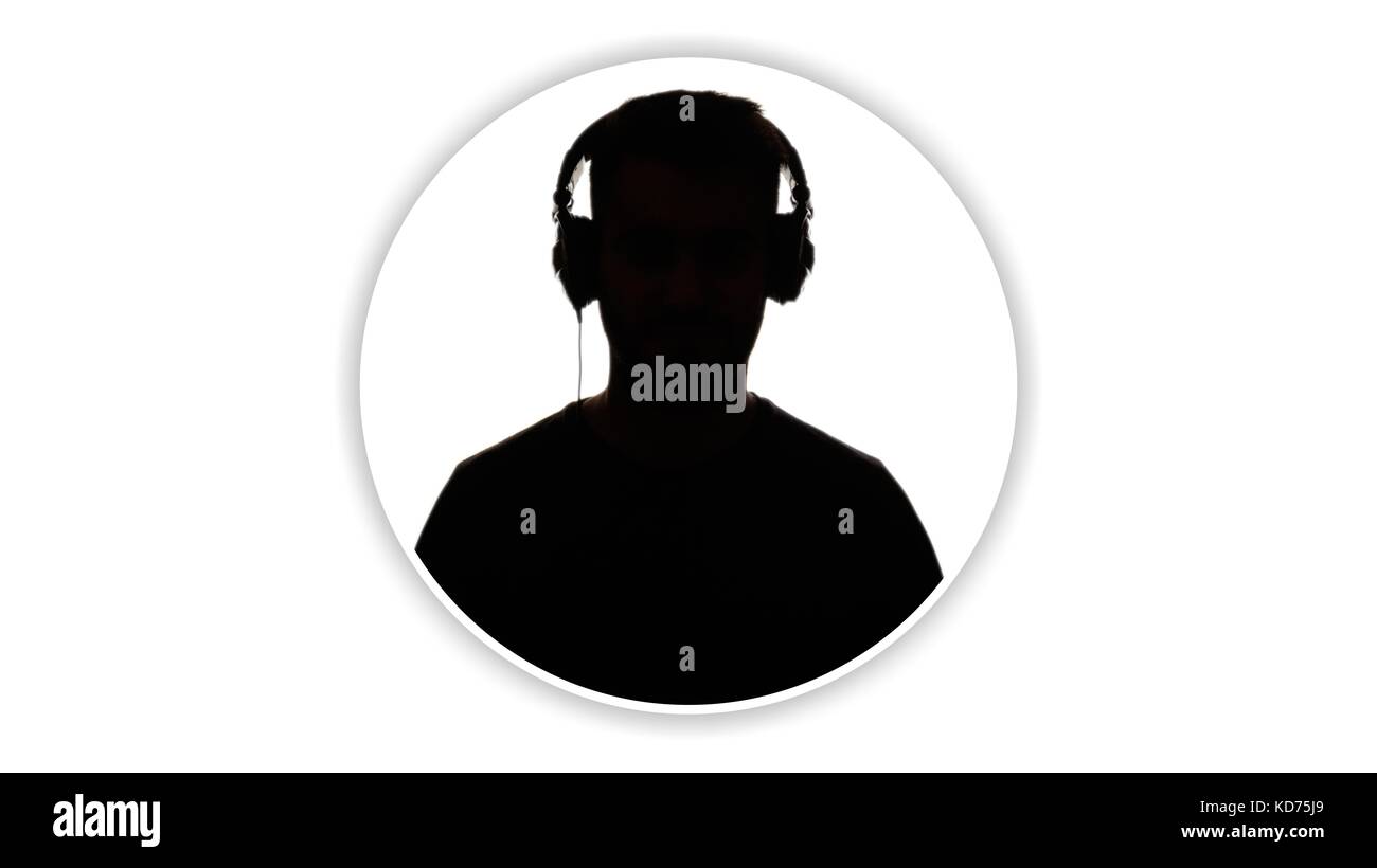 Silhouette of a man's head wearing headphones on white background Stock Photo