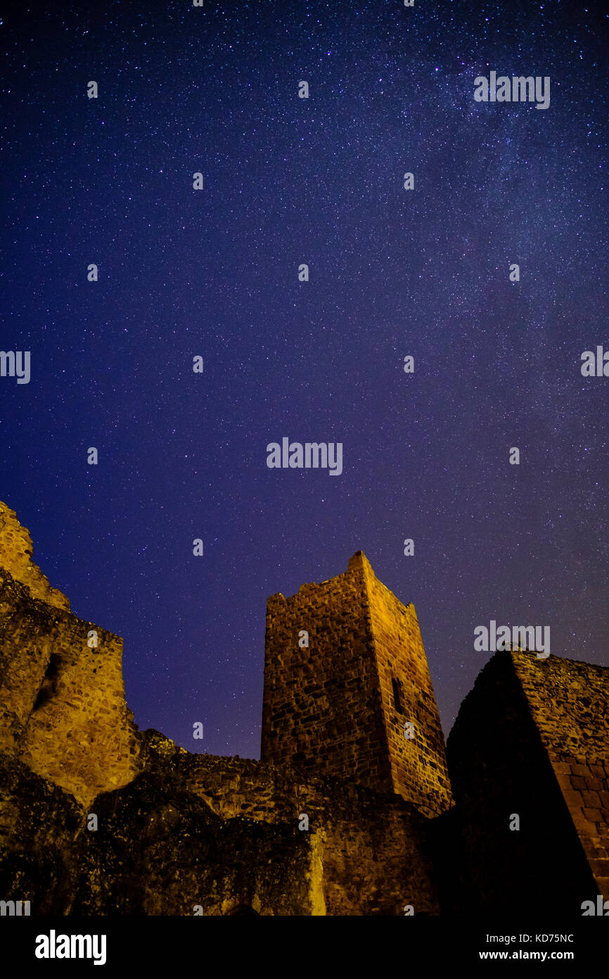 Stars are shining on the ruins of castle Ulrichsburg at night Stock Photo