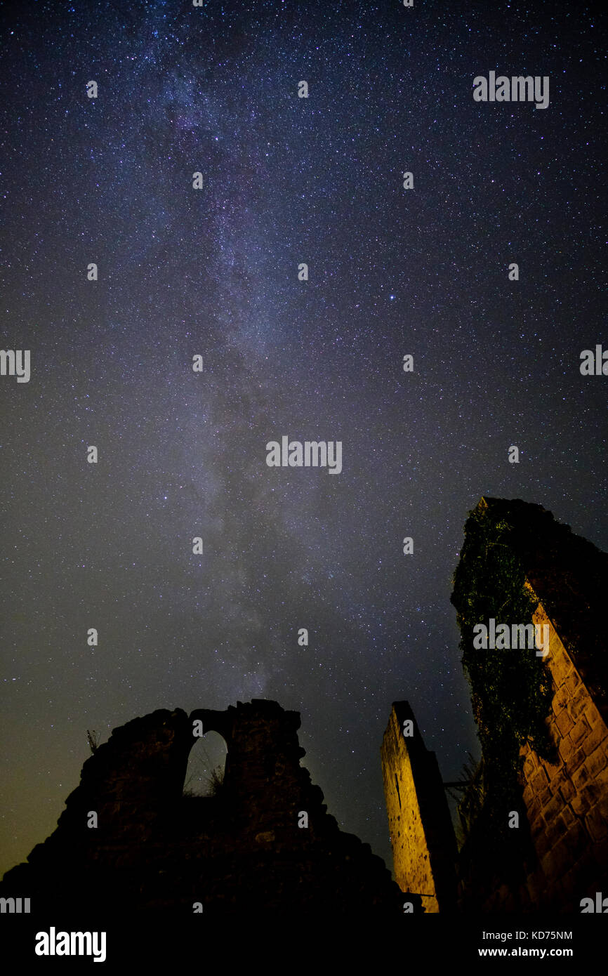 Stars and Milky Way are shining on the ruins of castle Ulrichsburg at night Stock Photo