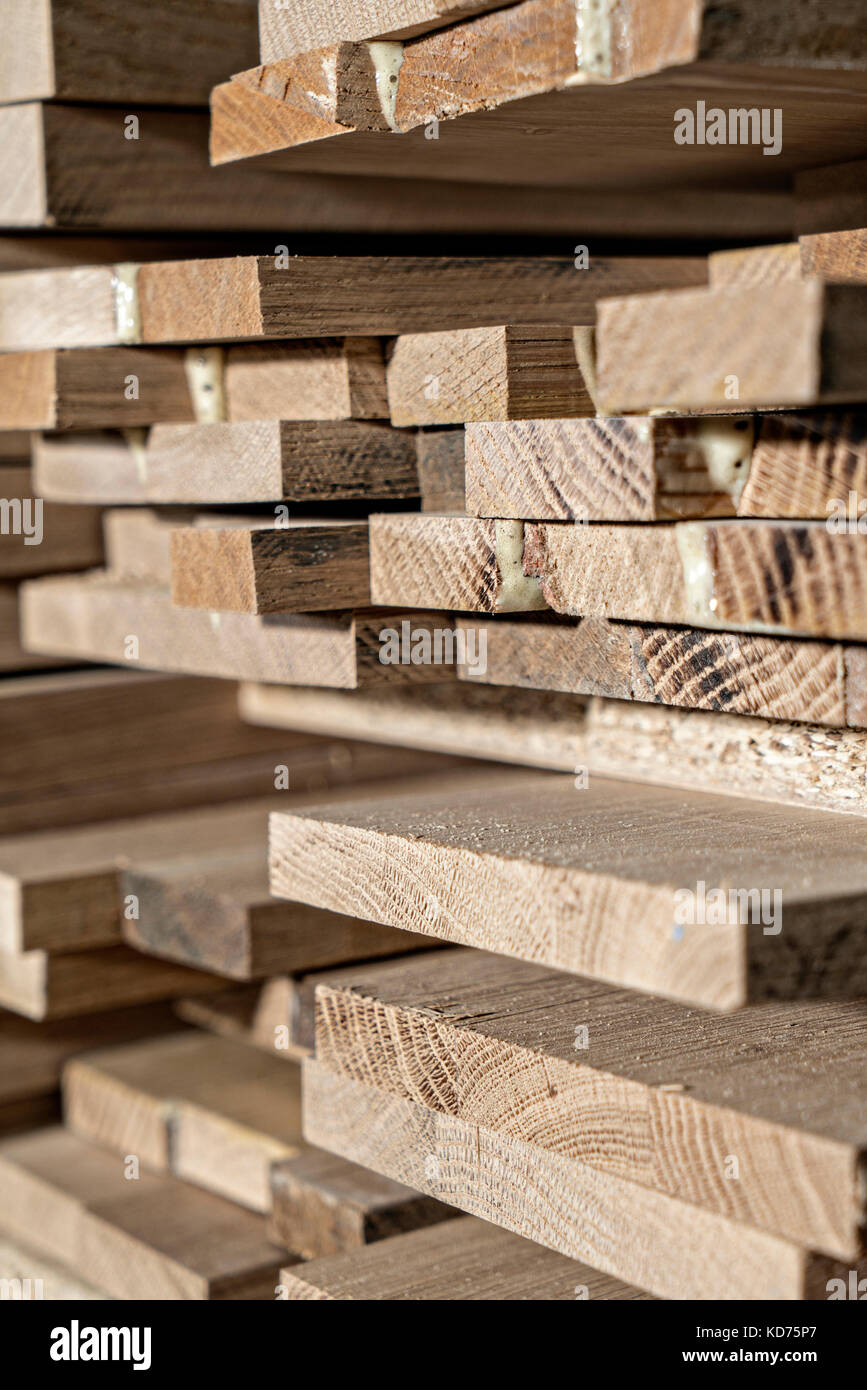 Pile of lumber ready to be used in a construction Stock Photo