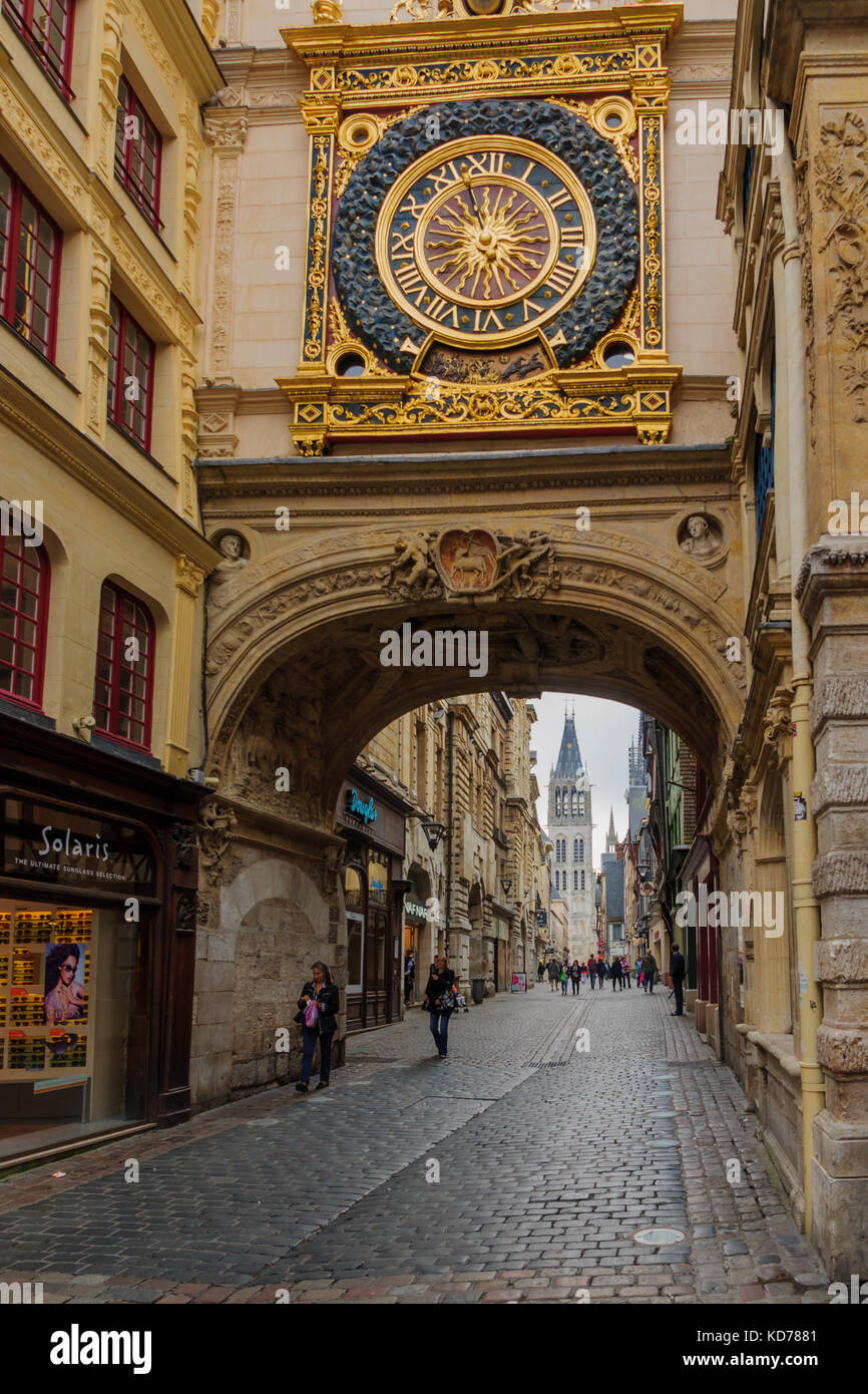 ROUEN, FRANCE - SEPTEMBER 17, 2012: View of the Gros-Horloge (Great-Clock), a fourteenth-century astronomical clock, with local businesses, locals and Stock Photo