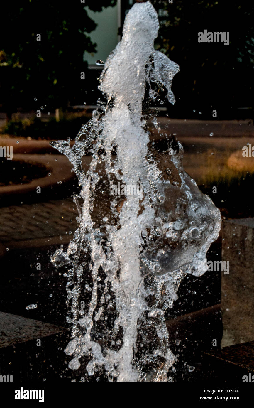 Water shooting out of a fountain, caught in mid-flight. Stock Photo
